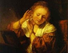 Rembrandt - A Young Woman Trying on Earings.    