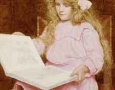 A young girl reading a book, seated in an interior. Bulleid  
