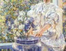 reid woman on a porch with flowers c1906. 