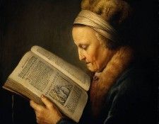 Old woman reading dictionary. , 