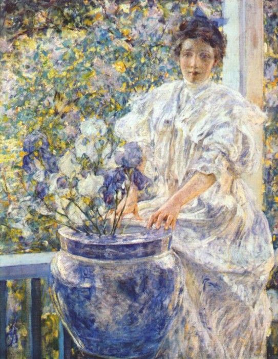 reid woman on a porch with flowers c1906. 