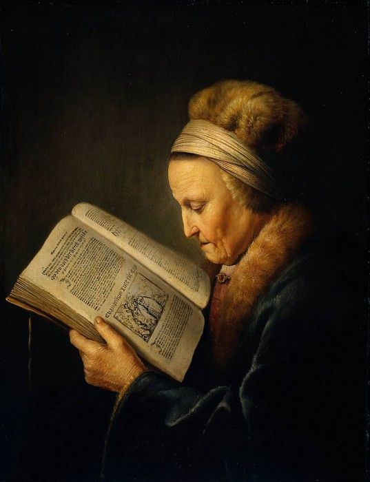 Old woman reading dictionary. , 